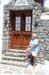 05 Lois at a beautiful varnished door, Mykonos