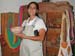 DSCN3086 Proprietor showing clay bowl made from the mud of the lake, 4x6 blowup