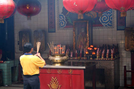 15 Offering Joss Sticks at Temple