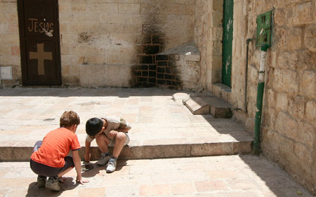 15  Children playing--note cross on door and Jesue written there, Jerusalem