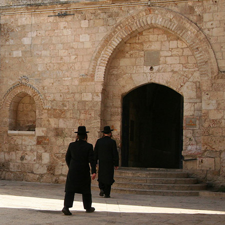 22 Hasadic Jews walking into temple, Jerusalem