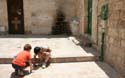 15  Children playing--note cross on door and Jesue written there, Jerusalem