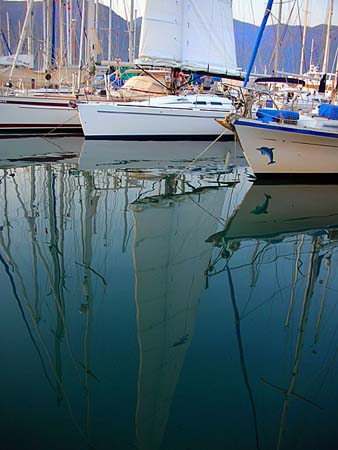 19 Single-sail yacht reflection, Marmaris Marina