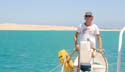 02 Chris at the helm, entering Suakin, Sudan