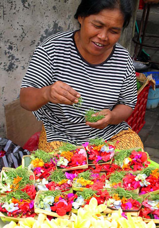 Balinese Woman selling petals at market