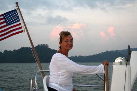 Ingrid at the helm leaving Singapore