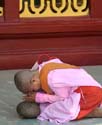 16-Nun-praying-over-stone