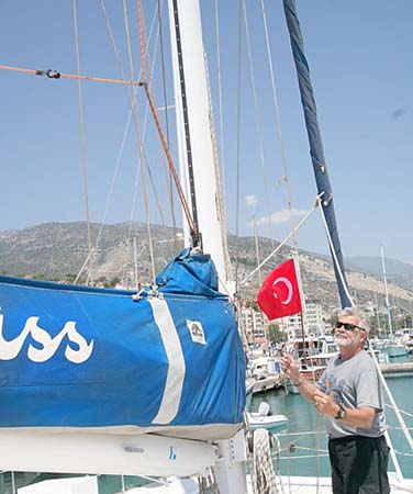 24 Joe Hoists Courtesy Flag for Turkey