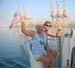 10  Lois and Chris at Helm, Leaving Salalah